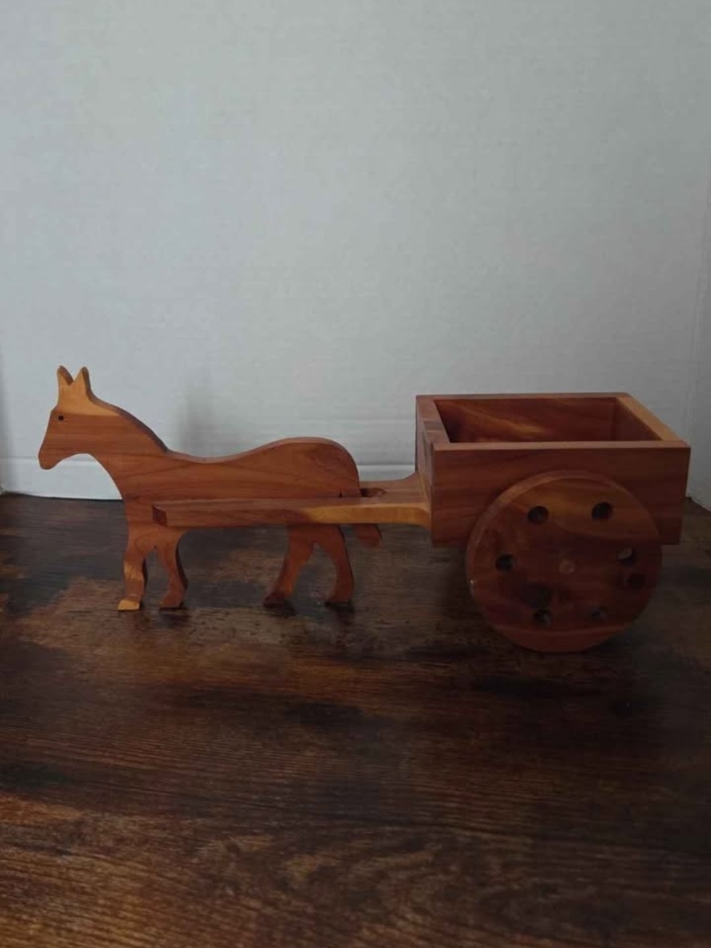 handcrafted wooden folk art horse-drawn wagon sculpture featuring a cutout horse